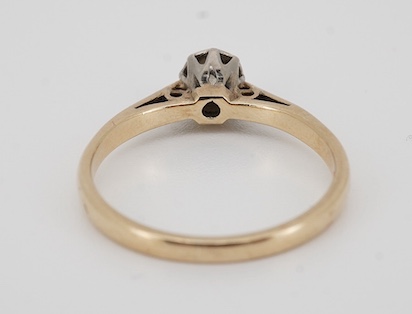 A solitaire diamond ring, collet-set with an antique circular-cut diamond weighing approximately 0.20 carats, mounted in 9ct gold, size L, British hallmarks, gross weight approximately 1.8 grams, Condition: fair